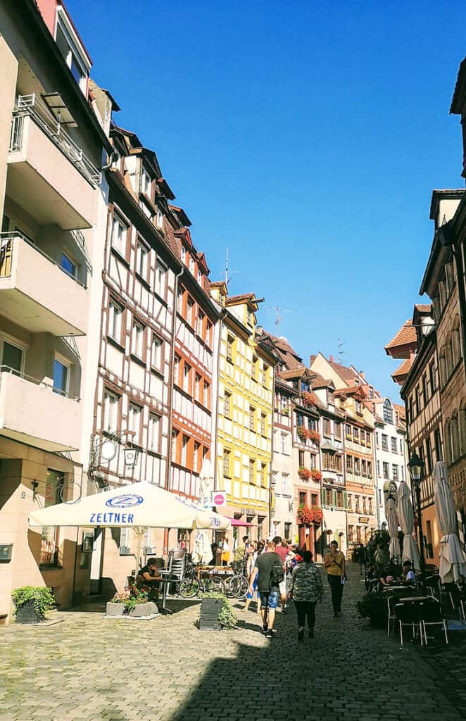 A row of 5 storey half timber houses painted in yellow and oranges, Nuremberg, Germany