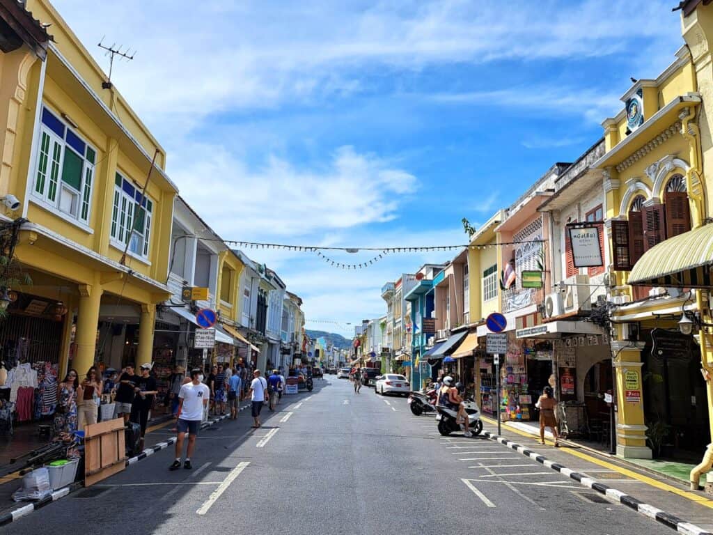 Pastel coloured buildings line the street in Phuket Old Town, Thailand